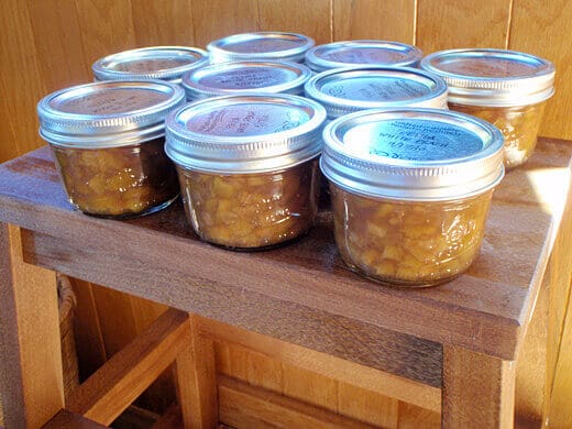 Sealed jars of feijoa-white peach preserves
