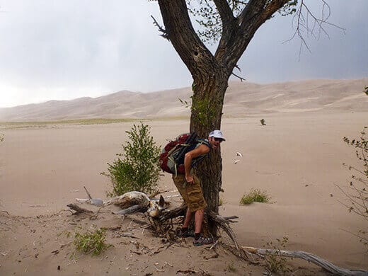Taking cover during a Great Sand Dunes windstorm