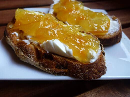 Orange-grapefruit-ginger marmalade with cream cheese on toast