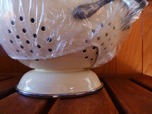 Substitute a shower cap for sticky plastic wrap