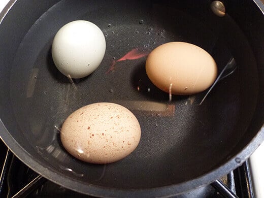 Cover eggs with cold water and bring to a rolling boil