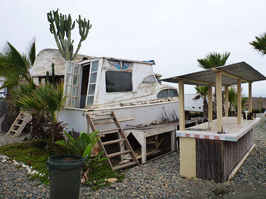 An old cabin cruiser turned surf shack