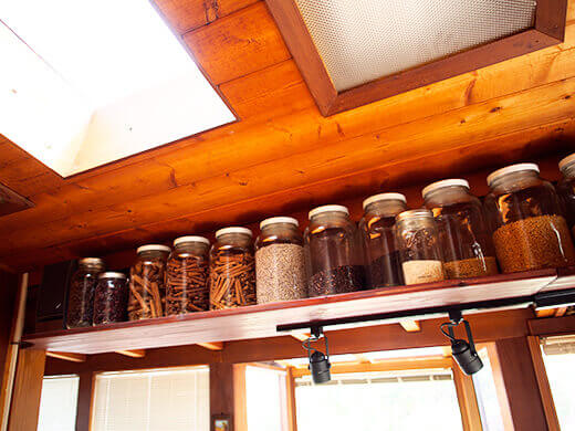 Open shelving filled with glass jars
