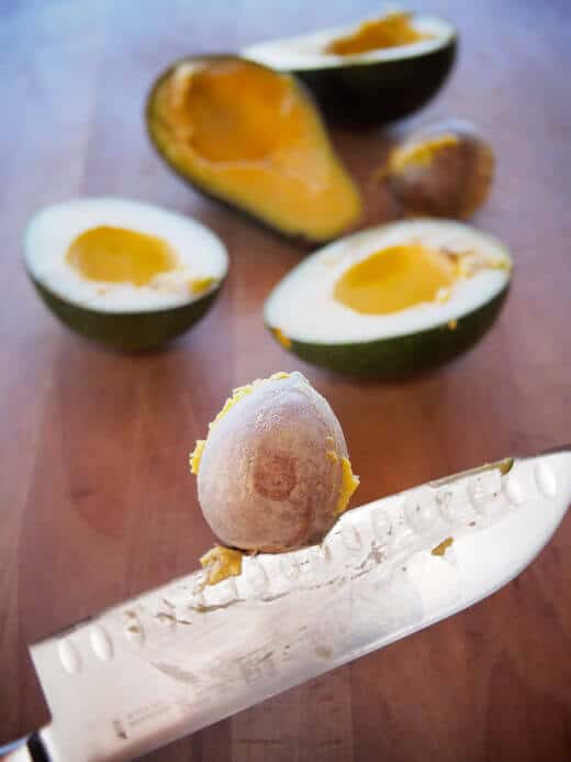Halve avocados and remove the pits