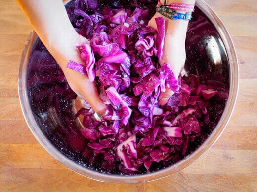Massage the salt into the cabbage to draw out moisture