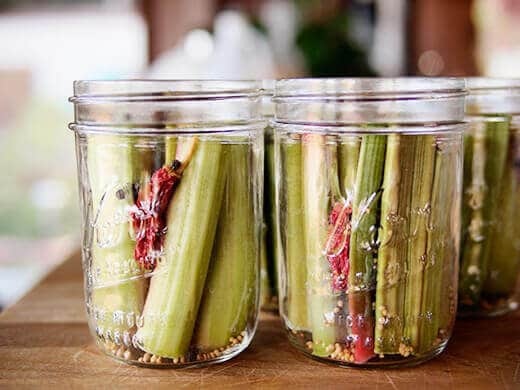 Pack jars with spices and rhubarb segments