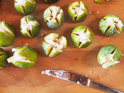 Fill each fig with goat cheese