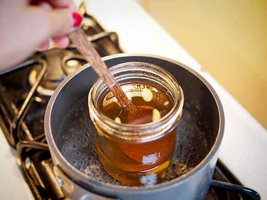 Stir walnut oil and beeswax until melted