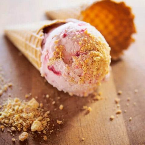 Cranberry cheesecake ice cream in a waffle cone