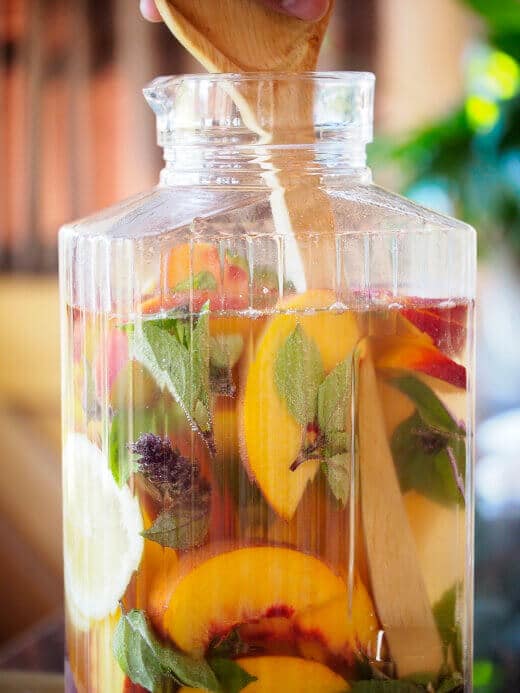 Combine all the sangria ingredients in a large pitcher