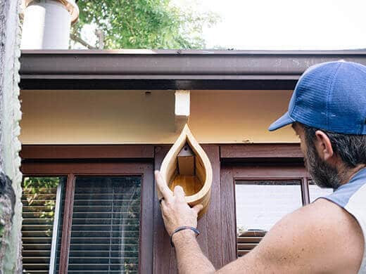 Hanging a native bee house