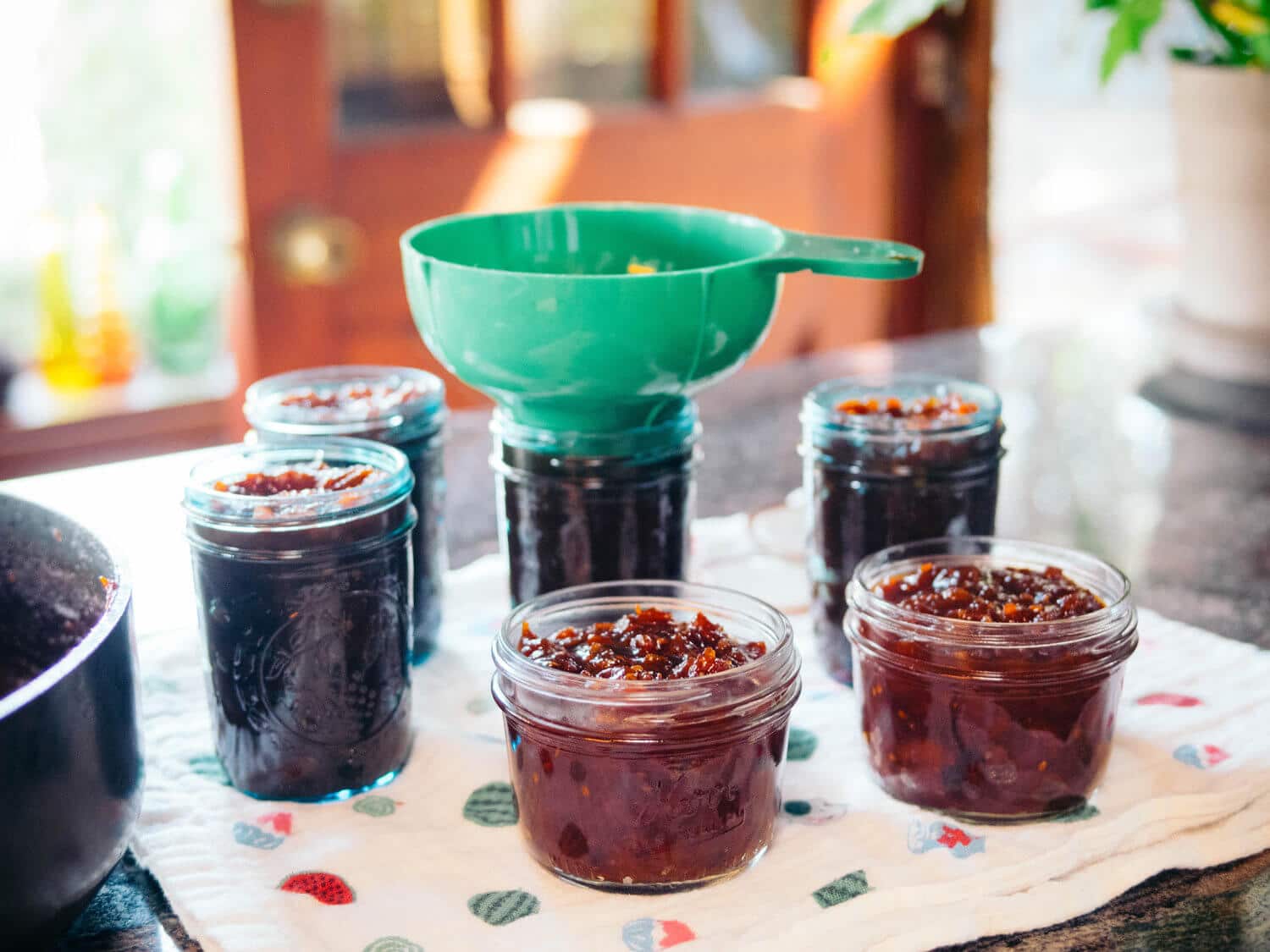 Ladle the jam into the prepared jars