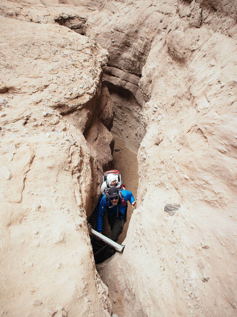 Climbing one of many ladders in Ladder Canyon