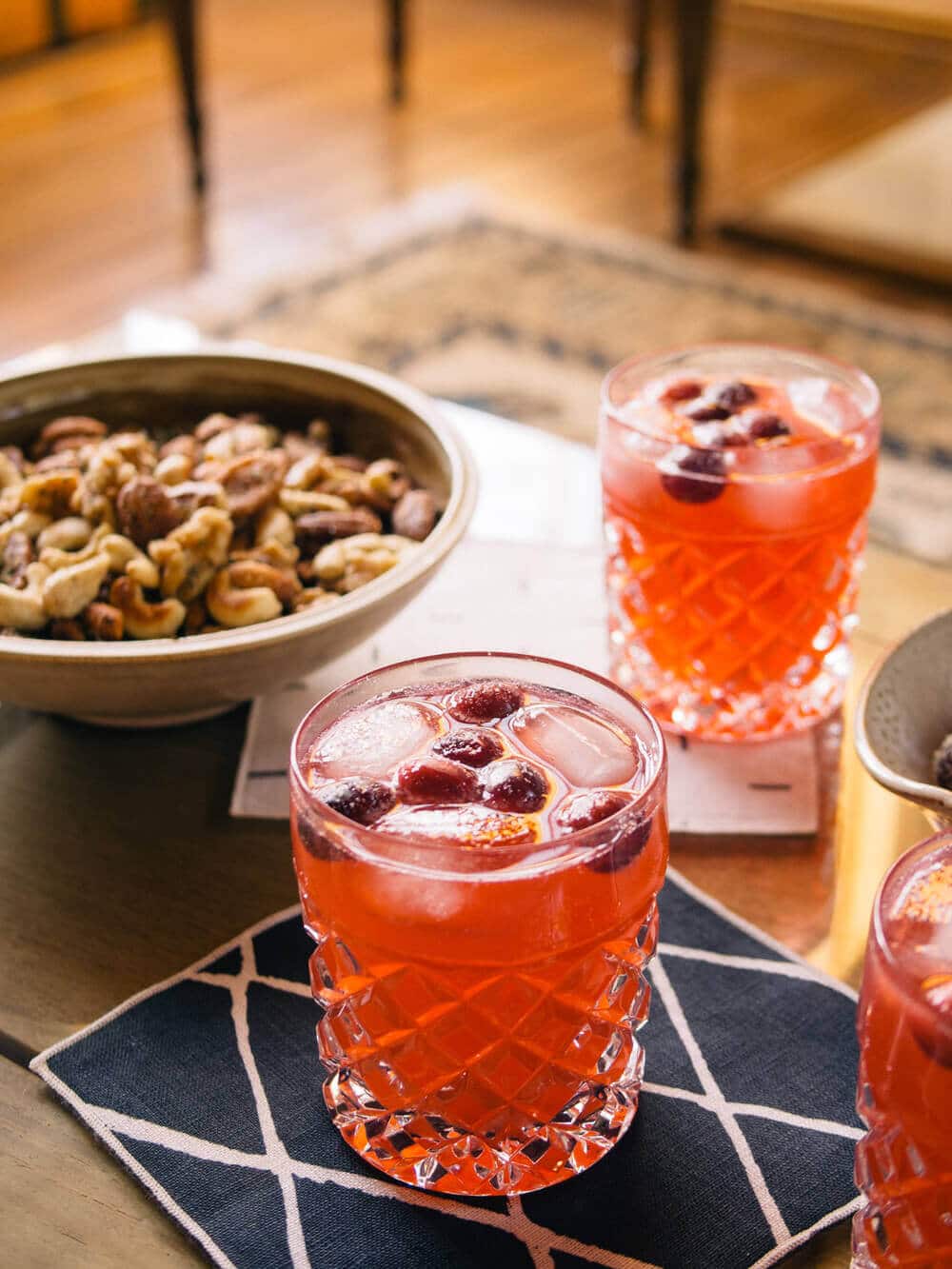 Cranberry moscow mules, sugared cranberries, and holiday nuts