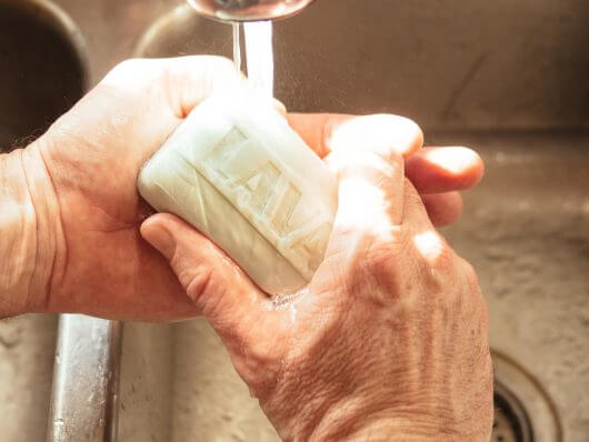 Lava Soap gently scrubs off grime, grease, glue, and paint while moisturizing hands