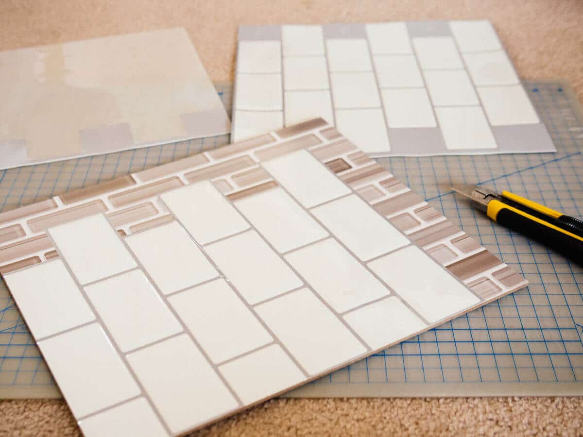 Covering the graphic backsplash panels with peel-and-stick tile