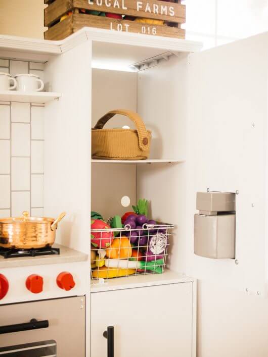 Shelf added to play fridge for extra storage