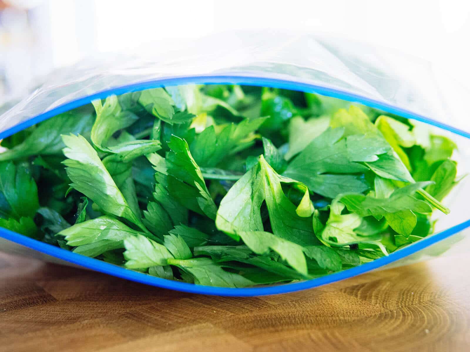 Freezer bag stuffed with parsley leaves