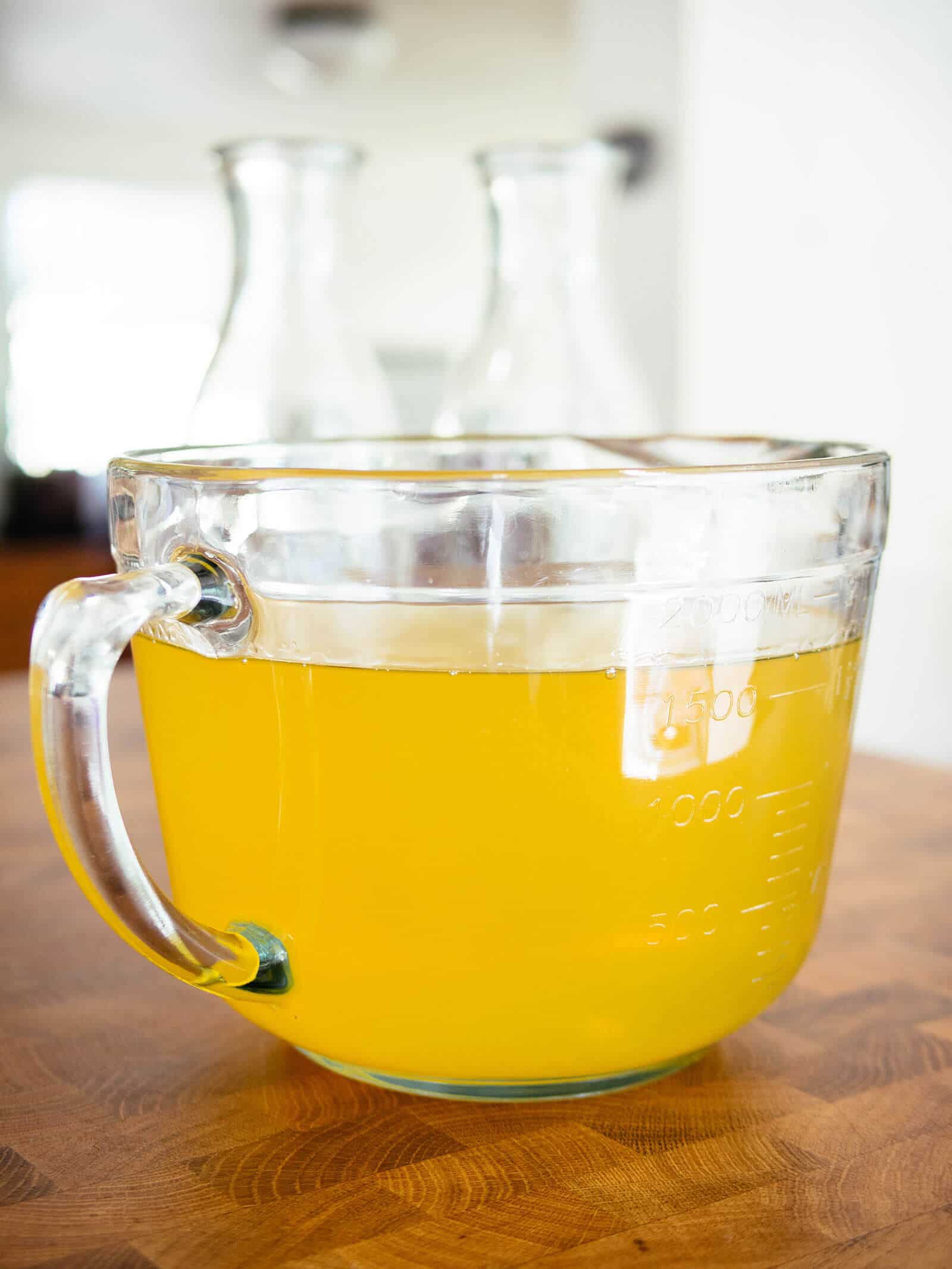 Bowl of bright yellow lemon-infused grain alcohol
