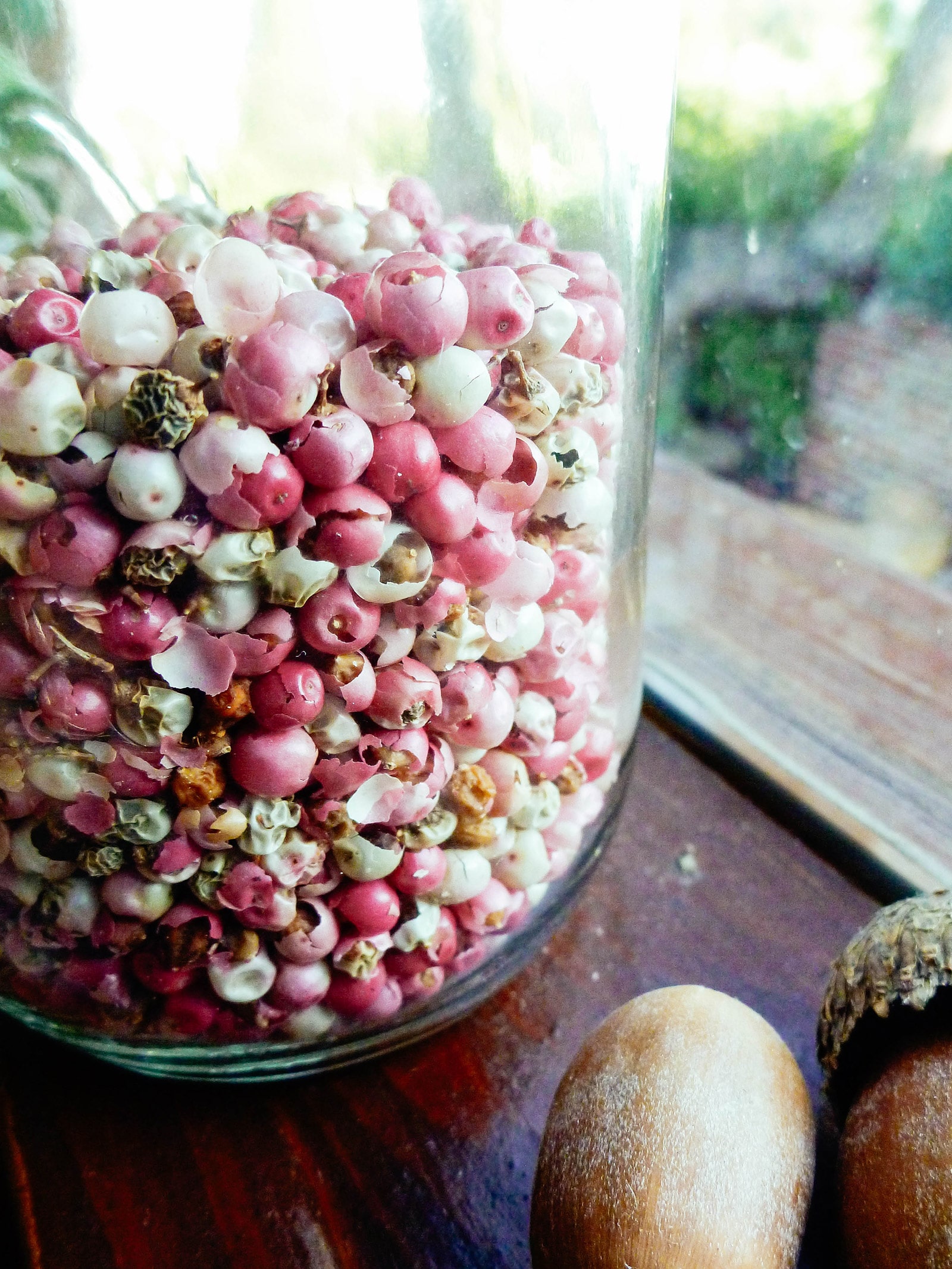 Peruvian pink peppercorns stored in a spice jar