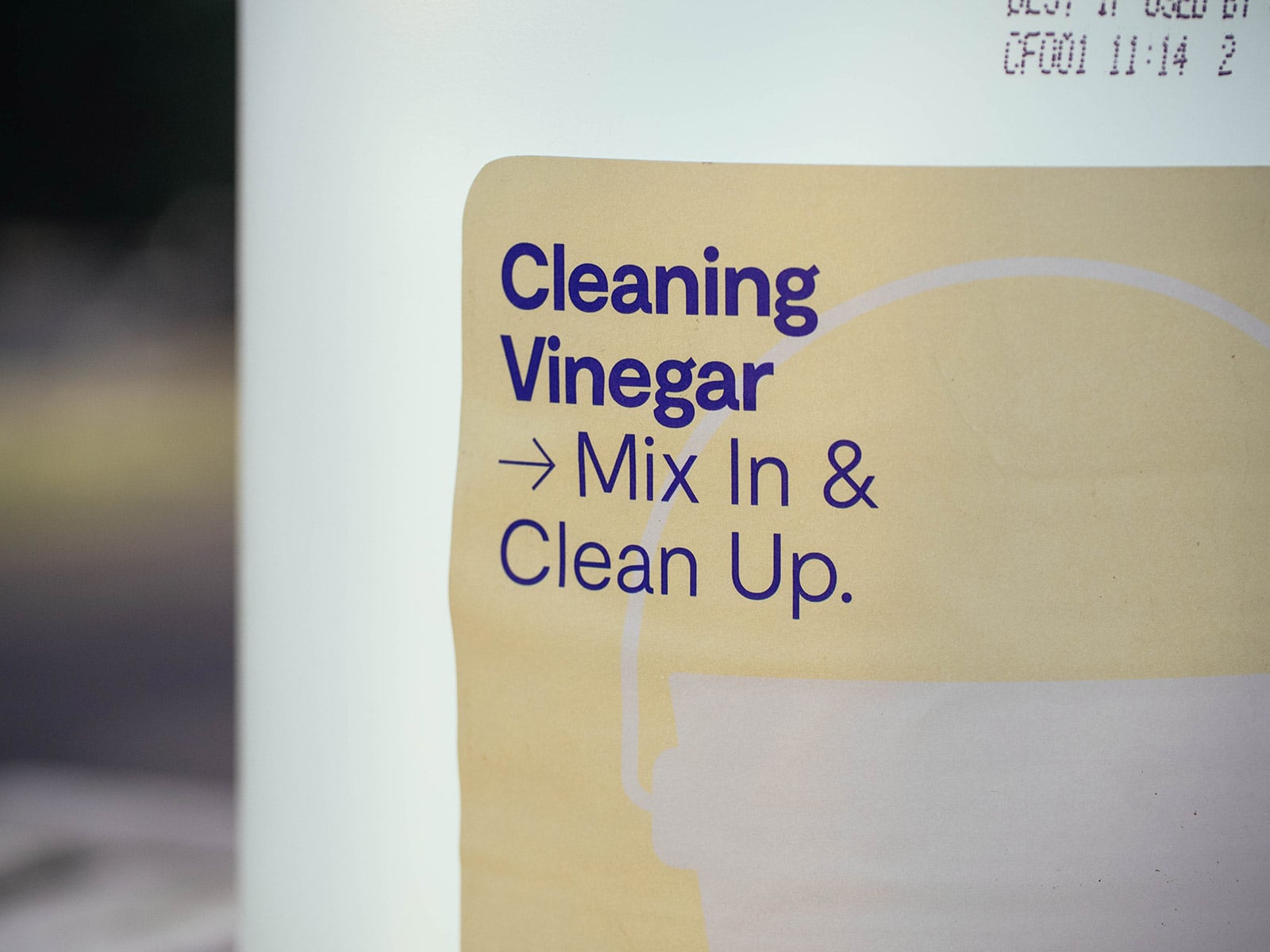 Close-up of cleaning vinegar label on a jug