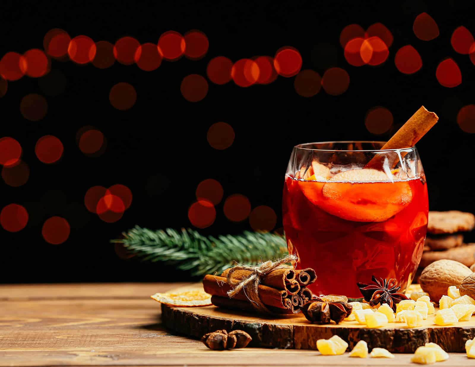 Glass of mulled wine on a wooden platter
