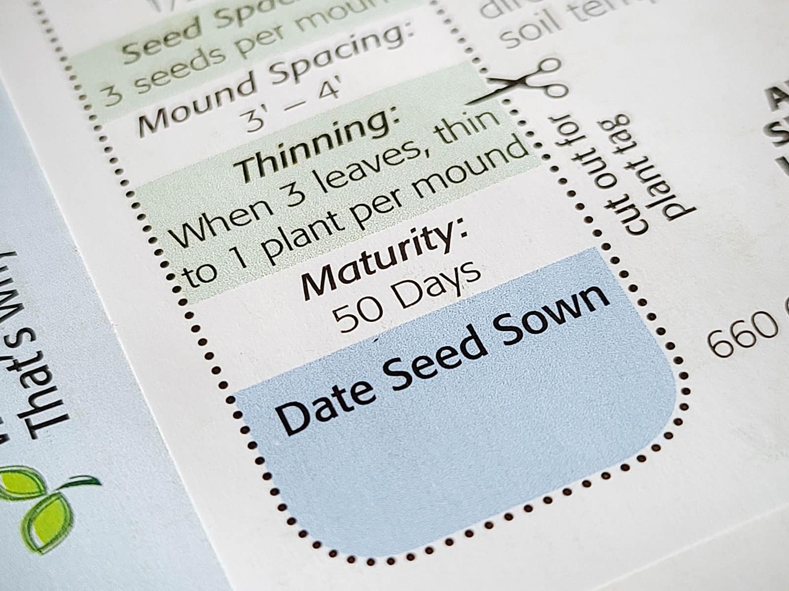 Close-up of sowing instructions on the back of a seed packet