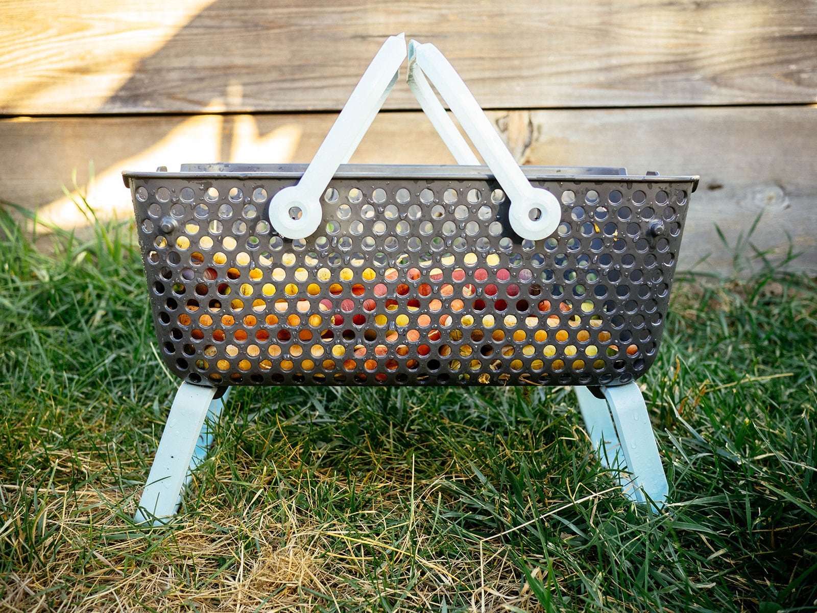 Side view of the Mod Hod harvest basket standing on grass