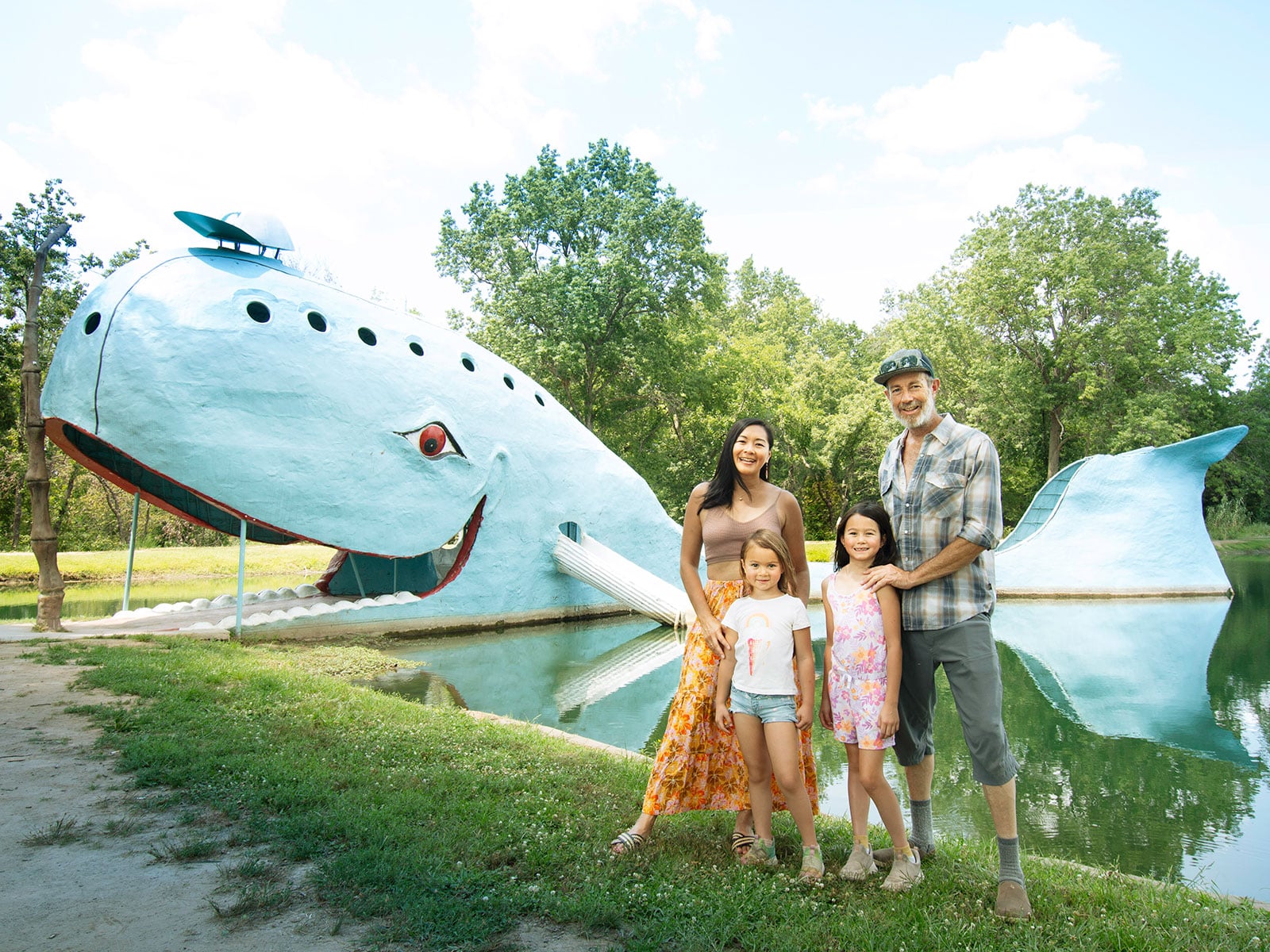 Author Linda Ly and family standing in front of the famous blue whale in Catoosa, Oklahoma